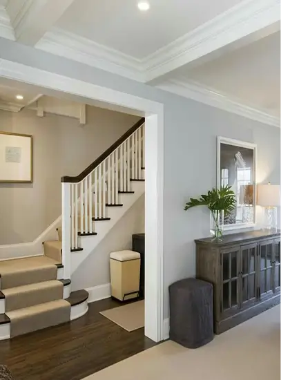 Finished residential interior with staircase and drywall walls in modern home